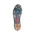 Bottom view of an iridescent soccer cleat soleplate with clear studs, a central red spine, and a grey elastic strap against a solid black background.