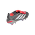 A dark grey and red Adidas Predator soccer cleat with white stripes and an iridescent sole, viewed from the rear side against a black background.