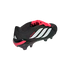 Black Adidas Predator soccer cleat with a red fold-over tongue, white triple stripes, and red accents on a black background.