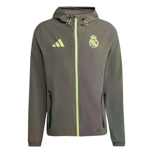 Dark grey Real Madrid hooded windbreaker jacket featuring neon yellow accents on the zipper and logos.