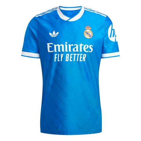 Bright blue Real Madrid soccer jersey featuring white trim, the Adidas Trefoil logo, club crest, and Emirates sponsor logo on the front.