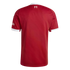 Rear view of a red Liverpool FC jersey with white collar and sleeve trim. A small white 97 emblem with flames is visible on the upper back.