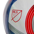 A close-up of a white soccer ball featuring a red MLS logo and curved blue and red graphics.