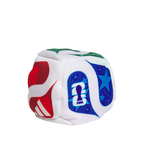 Small white plush cube featuring colorful FIFA World Cup 2026 and Adidas logos on its faces, set against a black background.