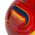 Close-up of a red soccer ball with yellow and blue graphics, featuring the yellow text "TRIONDA CLUB MATCH BALL REPLICA" against a black background.
