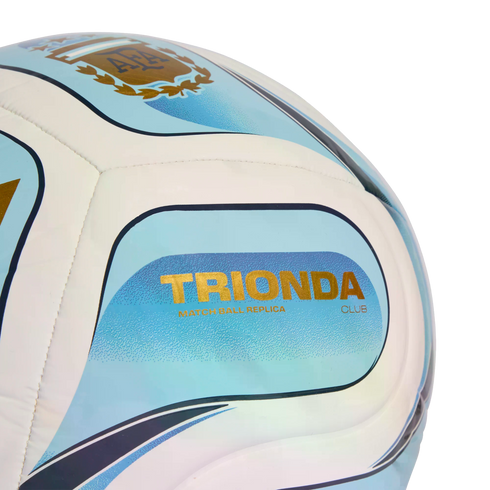 Close-up of a light blue and white soccer ball featuring the Argentine Football Association (AFA) crest and gold "TRIONDA" text.