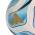 Close-up of an Adidas soccer ball with white, light blue, and dark blue curved panels and three gold stripes.