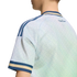 Rear view of a light blue and green patterned sports jersey featuring blue and gold trim and "italia" scripted on the back shoulder.