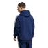 A man from the back wearing a navy blue Adidas zip-up hoodie and matching joggers, both featuring the iconic white three-stripes down the sides.