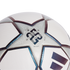 Close-up of a white and silver soccer ball with iridescent star panels. A central logo celebrates 23 years as the official match ball supplier since 2001.