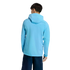 Back view of a person wearing a light blue hooded jacket and dark blue shorts against a solid black background.