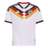 A white German national football team jersey with a black, red, and gold geometric chevron pattern on the chest, featuring the Adidas logo and team crest.