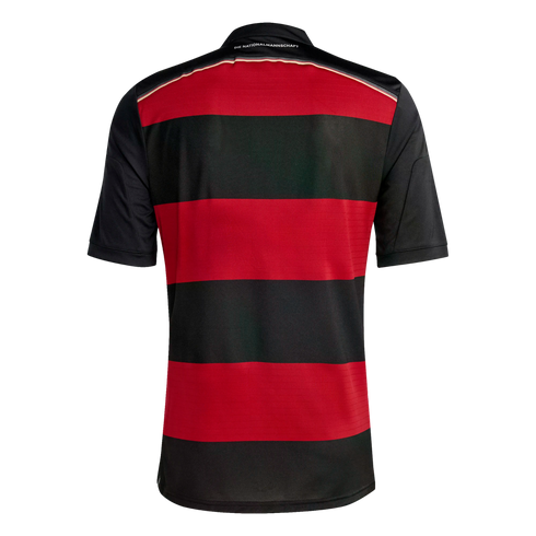 Back view of a red and black horizontally striped soccer jersey with solid black sleeves and "DIE NATIONALMANNSCHAFT" text on the back collar.