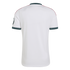Back view of a white short-sleeved jersey with teal patterned collar and cuffs, pink shoulder stripes, and "RMCF" embroidered on the neckline.