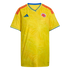 A yellow Colombia national team soccer jersey featuring red shoulder stripes, blue trim, and a subtle tonal butterfly wing pattern.