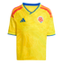 Yellow Adidas Colombia soccer jersey with blue v-neck trim, red shoulder stripes, and a subtle butterfly wing graphic.