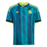 Teal soccer jersey with a wavy navy pattern, lime green trim, an Adidas trefoil logo, and the Colombian national football team crest.