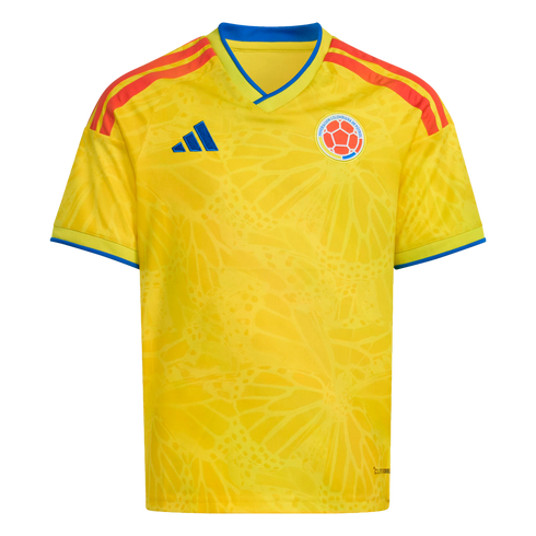 Bright yellow Colombia national football team jersey featuring a subtle butterfly wing pattern, the team crest, blue accents, and orange-red shoulder stripes.