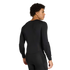 Rear view of a man wearing a black long-sleeved athletic compression shirt with elbow padding and matching black leggings.