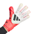 A hand wearing a red and white Adidas Predator goalkeeper glove with black stripes against a solid black background.