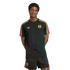 A man models a black Adidas kit with neon pink, orange, and yellow stripes and FPF crests on a black background.