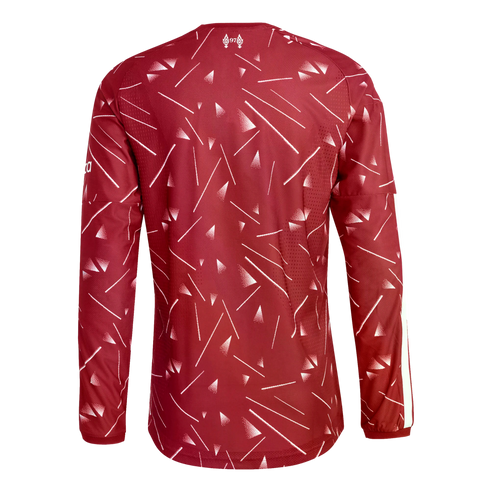 Back view of a maroon long-sleeved sports jersey with an abstract white geometric pattern of lines and triangles. A small white emblem is at the back neck.