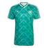 Green Adidas Germany soccer jersey with a bold geometric diamond pattern, white V-neck, white shoulder stripes, and the DFB crest on the chest.