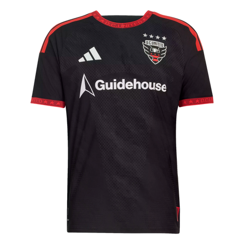 Black Adidas D.C. United soccer jersey with red trim and Guidehouse sponsor logo. Four stars sit above the team crest against a subtle textured background.