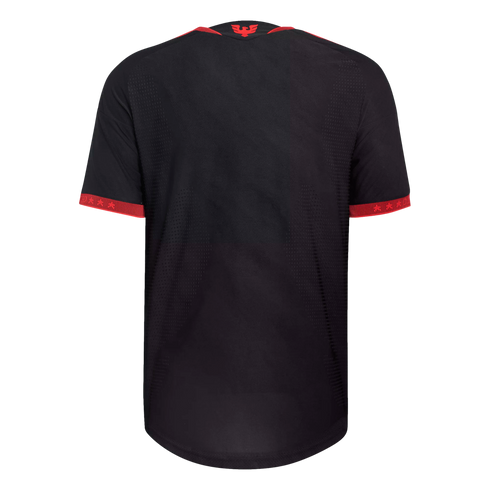 Back view of a black short-sleeved athletic jersey with red trim on the collar and cuffs, featuring a small red bird logo on the upper back.