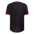 Back view of a black short-sleeved athletic jersey with red trim on the collar and cuffs, featuring a small red bird logo on the upper back.