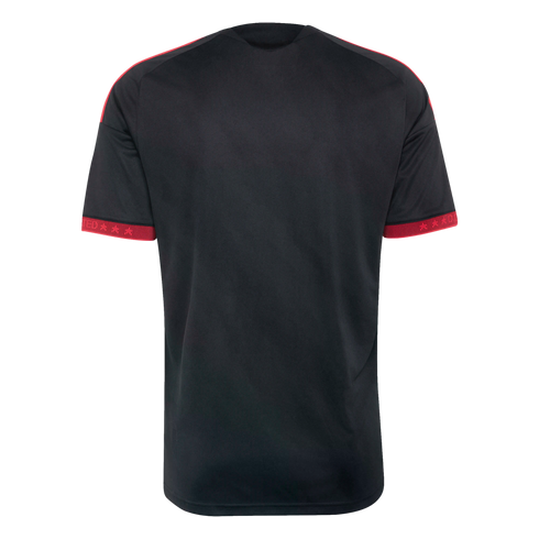 Back view of a black short-sleeved jersey with red shoulder stripes and red cuffs featuring stars and text.