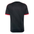 Back view of a black short-sleeved jersey with red shoulder stripes and red cuffs featuring stars and text.