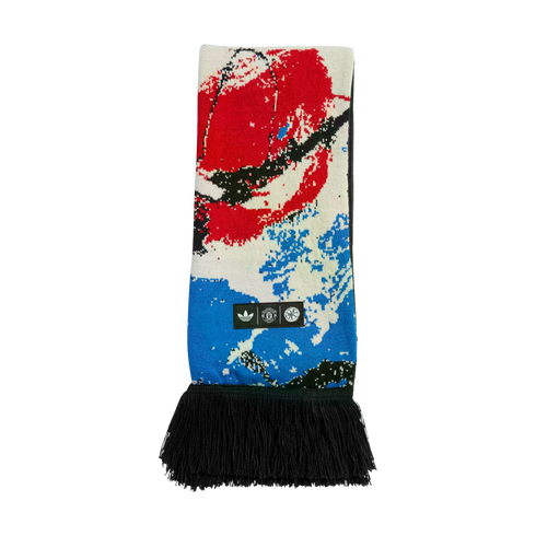 Manchester United x Adidas Stone Roses scarf featuring abstract red, white, and blue graphics, black fringe, and logos for Adidas, the club, and the band.