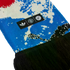 Close-up of a blue and white patterned knit scarf with black fringe. A black tag displays the white Adidas trefoil, Manchester United crest, and a circular logo.