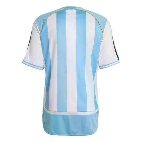 Back view of a light blue and white vertically striped soccer jersey with gold shoulder piping and three black sleeve stripes, isolated on a black background.