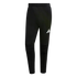 A pair of tapered black Adidas joggers with a white logo on the thigh and ribbed knee detailing, set against a solid black background.