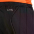Close-up of black Adidas ClimaCool athletic pants with an orange shirt visible at the top waistband.