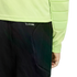 Close-up of a person wearing a lime green long-sleeved padded shirt and black pants with "CLIMACOOL" printed near the waistband against a black background.