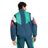 Rear view of a man wearing a retro-style, color-blocked tracksuit in navy blue, green, white, and red.