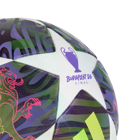 Close-up of a UEFA Champions League soccer ball featuring "BUDAPEST 26 FINAL" on a white star panel, with purple, green, and pink graphic patterns.