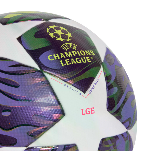 Close-up of a UEFA Champions League replica match soccer ball with purple and green patterned star panels.