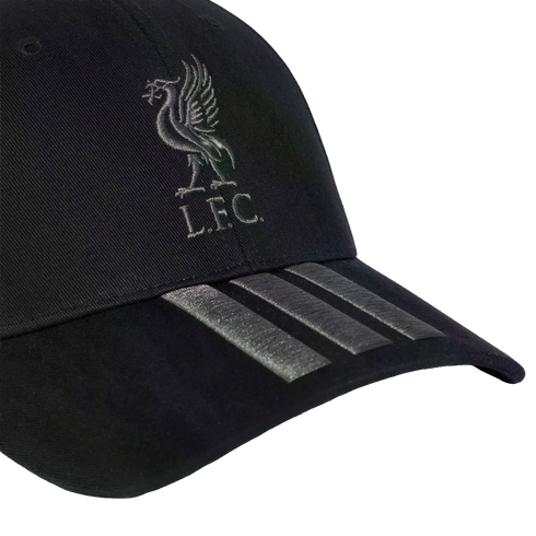 A black baseball cap featuring a silver Liverpool FC crest on the front and three silver Adidas stripes on the brim.