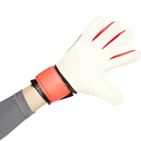 A hand wearing a white and red soccer goalkeeper glove with fingers spread wide.
