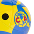 Close-up of a yellow and blue soccer ball featuring the Club América logo and an inflation valve hole.