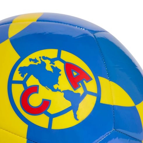 A blue and yellow soccer ball featuring the Club América logo, which includes a map of the Americas and red "C" and "A" letters.
