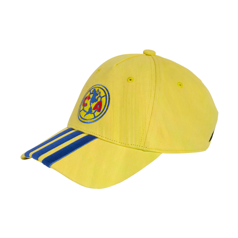 Yellow baseball cap featuring the Club América logo on the front and three blue stripes on the brim, set against a black background.