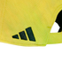 Close-up of the back of a bright yellow cap with the dark green Adidas mountain logo embroidered on the side.