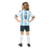 Back view of a child in a light blue and white striped Messi #10 soccer jersey, dark shorts, and white socks, standing against a black background.
