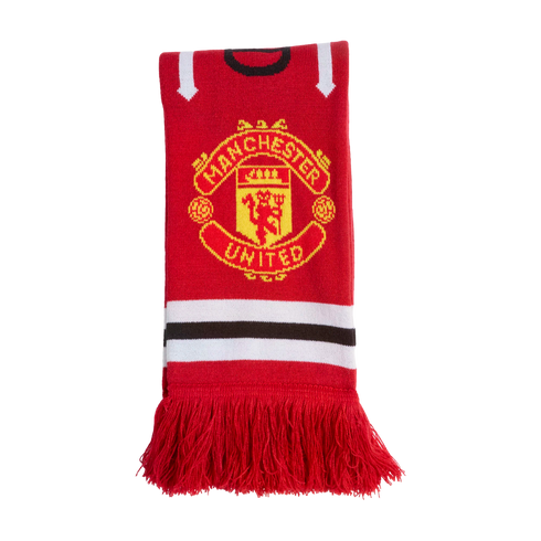 Red Manchester United knitted scarf with the club's crest in yellow and red, horizontal white and black stripes, and red fringe at the bottom.