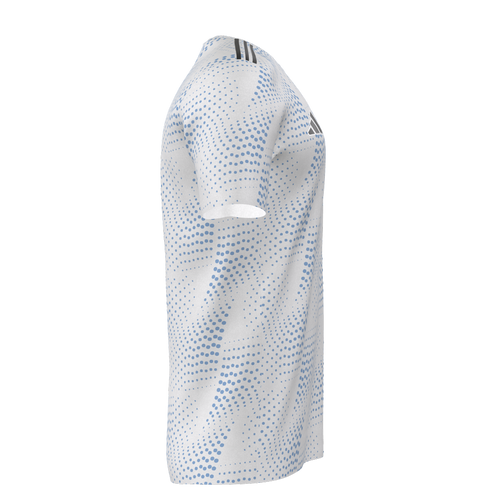 Side view of a white t-shirt featuring a light blue halftone dot pattern. Three black stripes accent the shoulder, with a small logo on the chest.